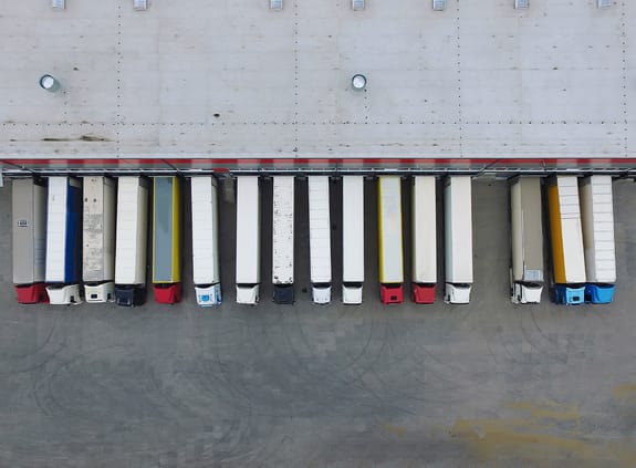 lorries parked at depot to be loaded