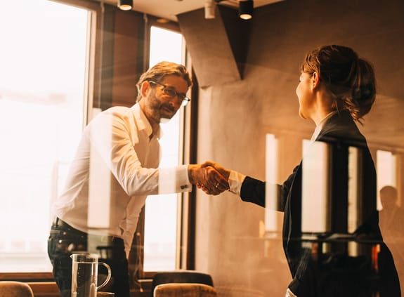 Man and woman shaking hands