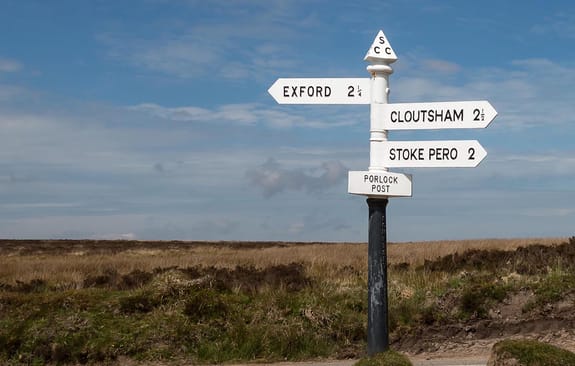 Old-fashioned road sign in the countryside