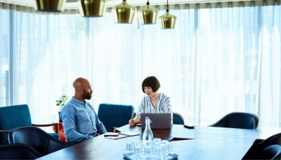 Couple in conversation in a modern office setting