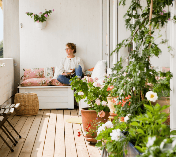 Woman on her balcony looking to the distance