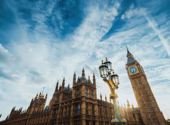 Looking up at Houses of Parliment and Big Ben with sun breaking through the building
