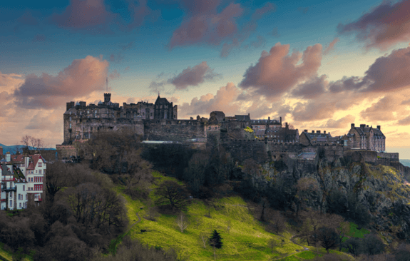 Edinburgh castle looking over the city at sunset 