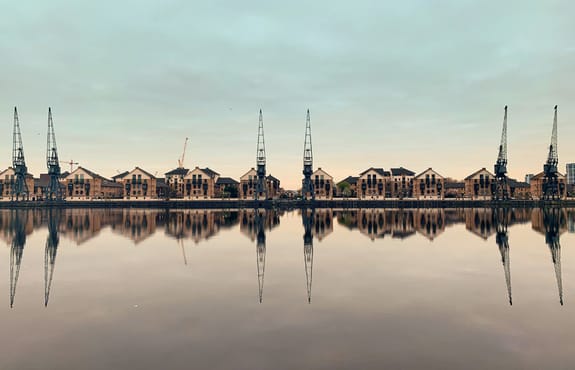 Docs reflected on a still river
