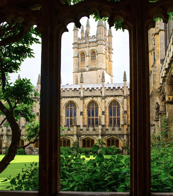 Framed view of a stately university from within the grounds