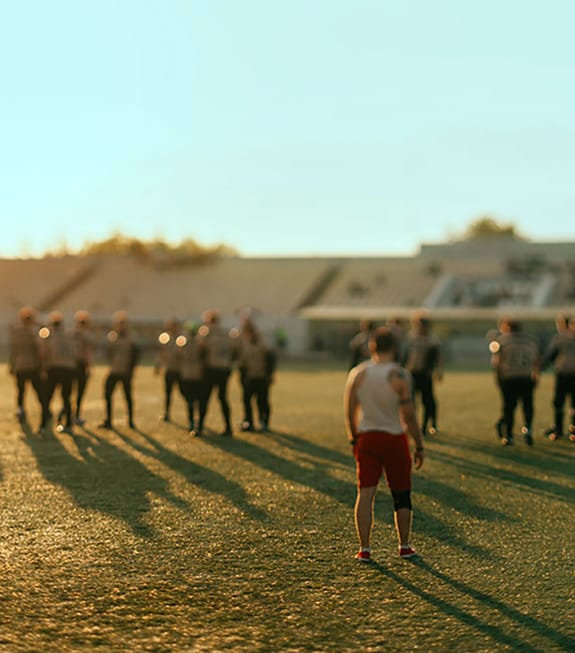 Young men playing rugby