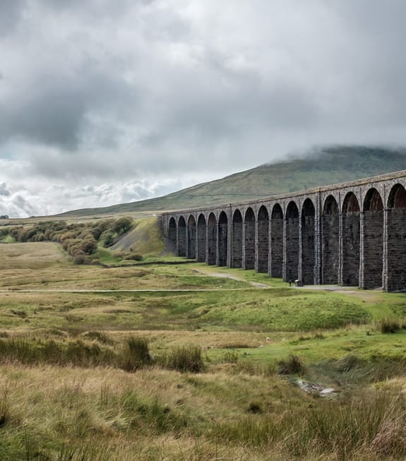 train track bridge over countryside