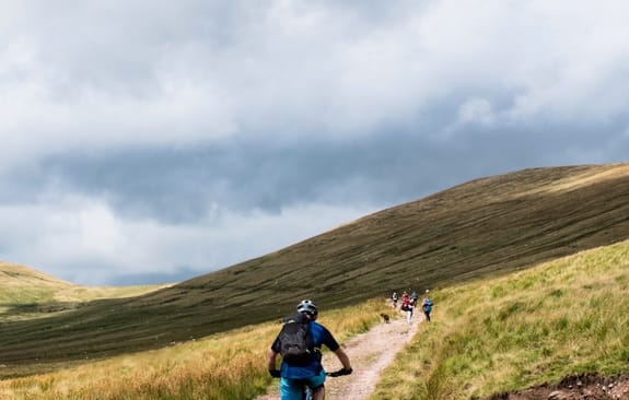 Cyclist looks ahead at mountain path