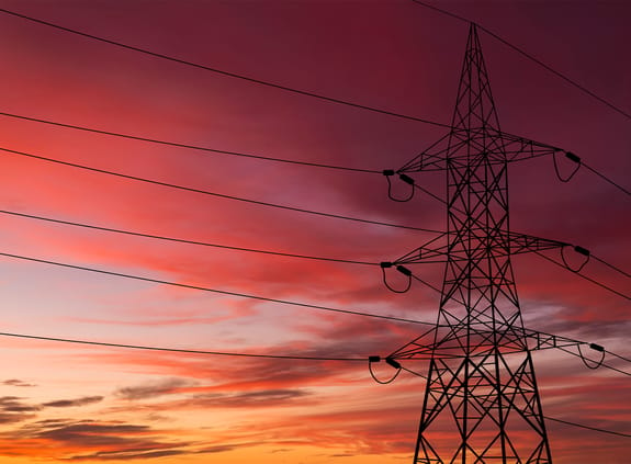 power pylon and cables at sunset
