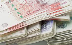 Deluge of weak UK data weighs on sterling