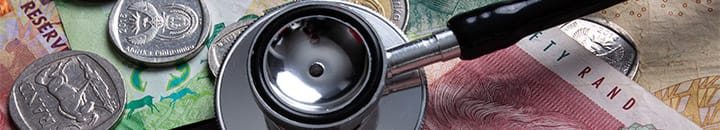 Stephoscope on top of Rand notes and coins
