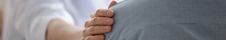 A tendor arm being places on a colleague's shoulder