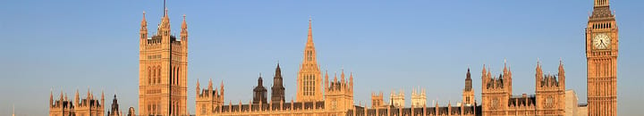The Houses of Parliament are bathed in the light of early morning sunshine.