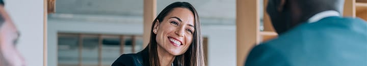 Female business leader meeting people to help them with their business