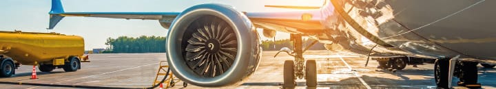 Plane being re-fueled on runway