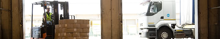 Fork lift truck moving boxes from lorry