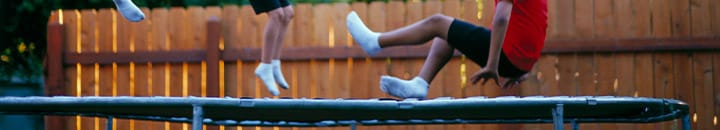 Children bouncing on a trampoline