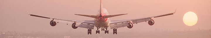 plane landing with sunset