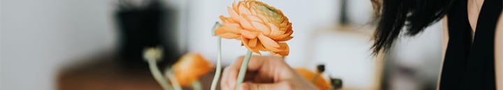 Female smelling flower