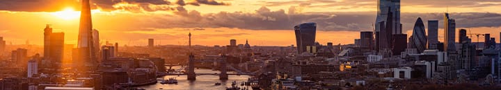 London skyline with sunset breaking through the clouds