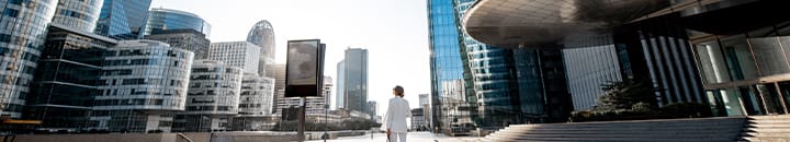 Female admiring the skyline of modern office buildings