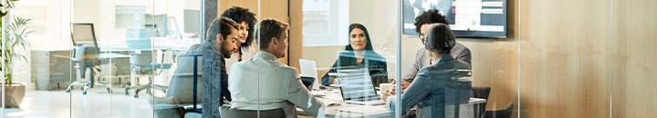 team discussing around a meeting table