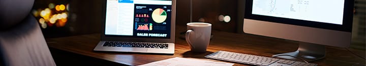 Office desk with portfolio on laptop