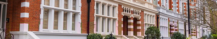 Entrances of red bricked terraced houses