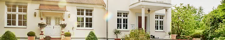 front of a luxury home