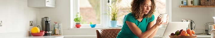 female watching a remote viewing on a laptop from home