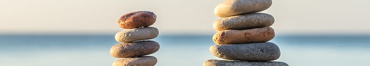 Stones piled on top of each other by the sea