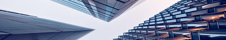 Looking upwards as three buildings close together