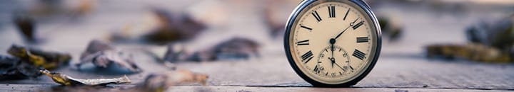 pocket watch sitting on a floor