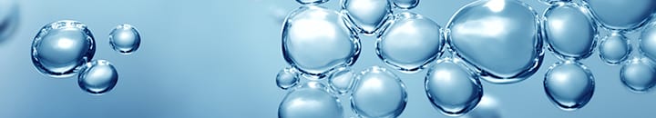 transparent effervescent blue gas bubbles levitating in macroscopic view