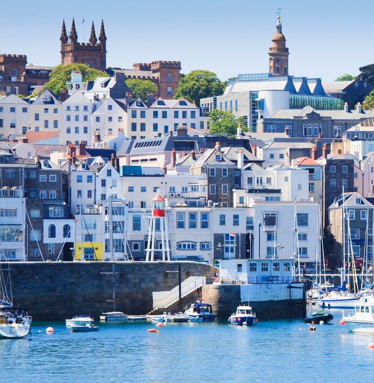 A view of Guernsey from the harbour on a sunny day 