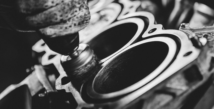 The inside of an internal combustion engine are polished by a mechanic