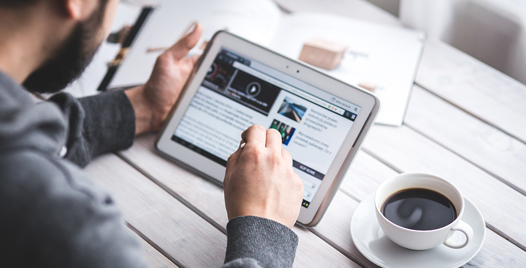 Man working on his tablet device