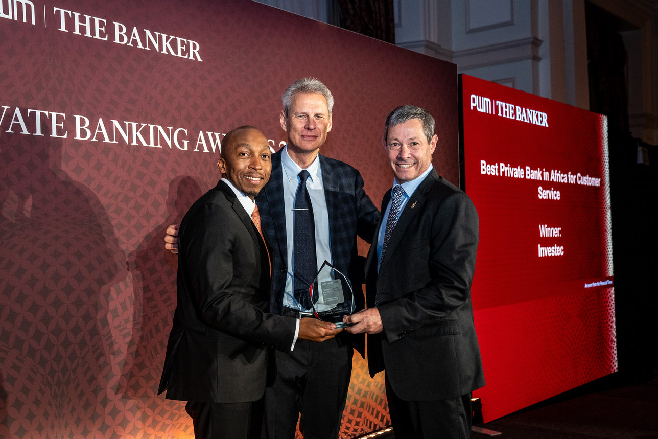 Leaders holding award