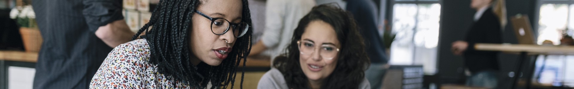 Two women talking business in a coffee shop