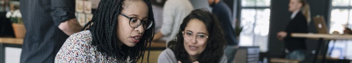 Two women talking business in a coffee shop