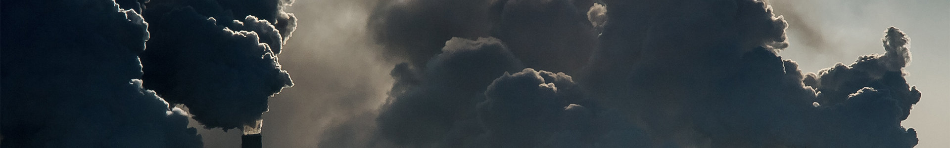 coal fired plant with smoke billowing 