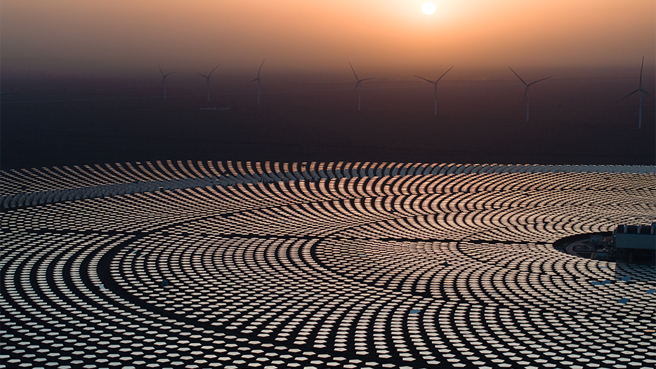 solar panels with wind turbines in desert in Africa