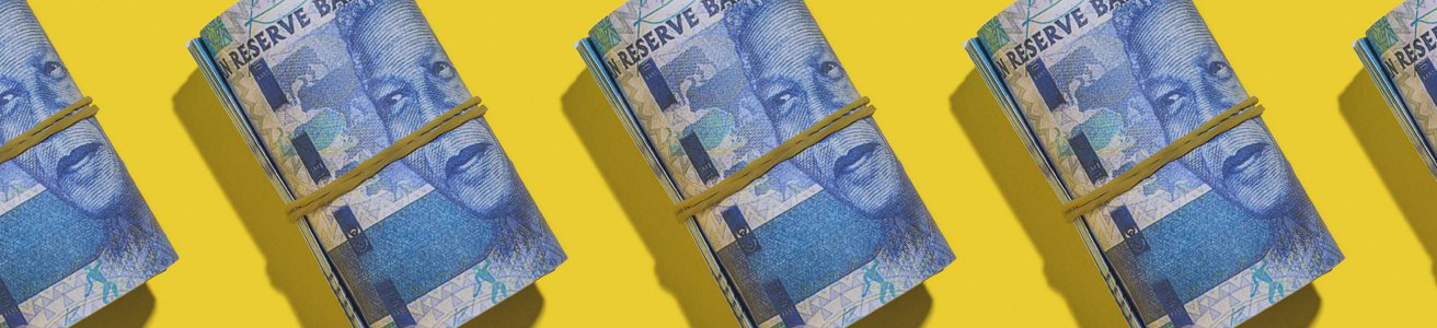 Rand notes being rolled