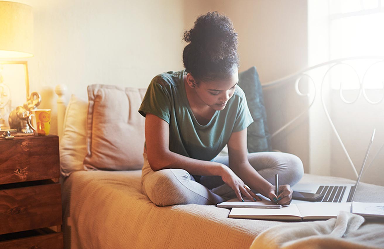 Female student revising at home