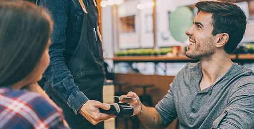 Man paying for bill with credit card