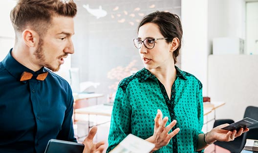 male and female discussing social media