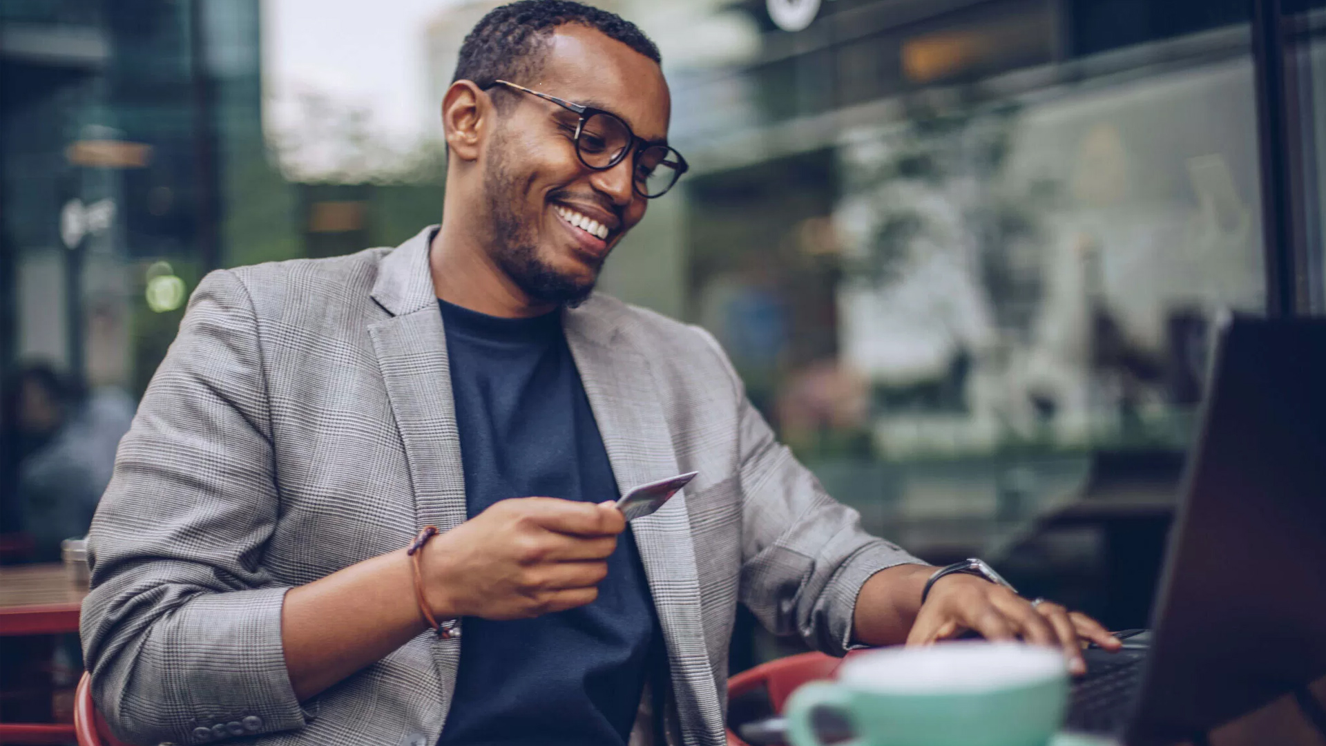 Man smiling at cafe