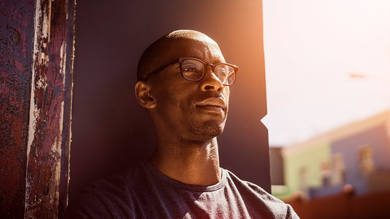 man wearing glasses looking pensive