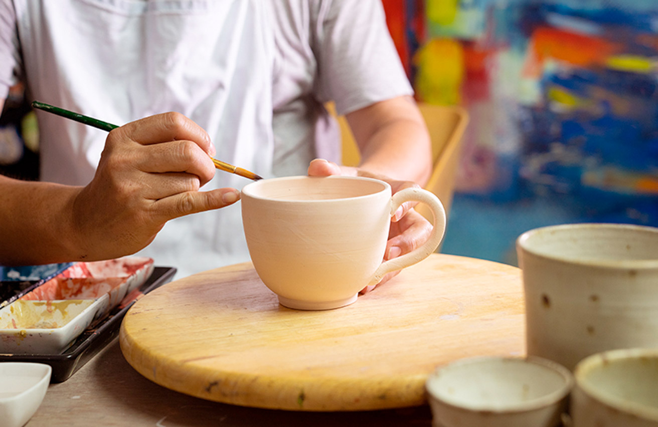 Painting pottery cup made at home