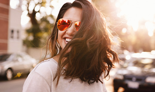 Young female smiling in the street